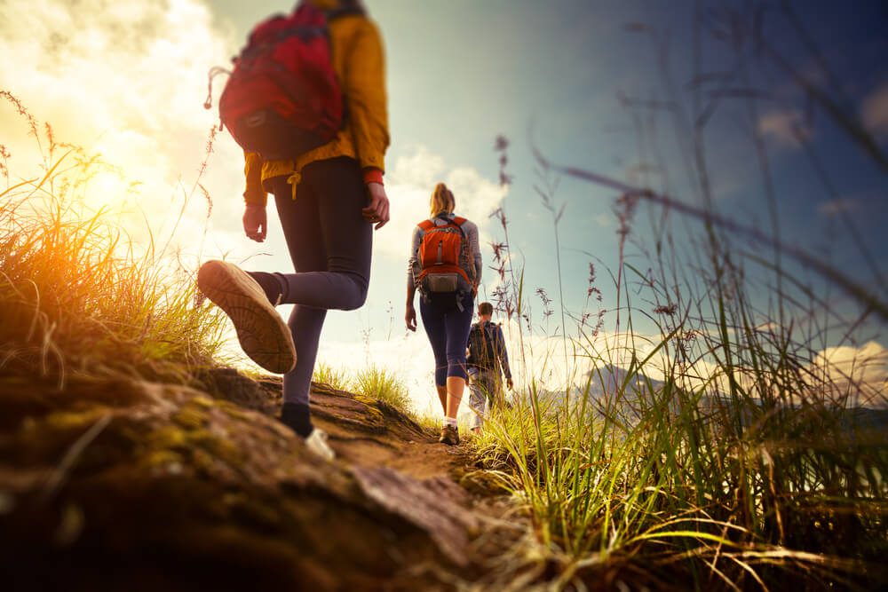 A group hiking on a trail in Texas Hill Country.