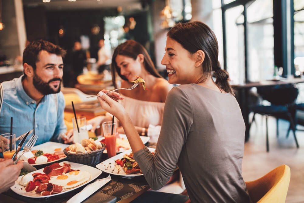 A group eating breakfast at a restaurant in Fredericksburg.