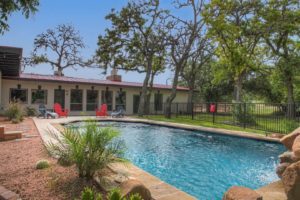 A vacation rental with a pool in Fredericksburg, TX,  perfect for relaxing in after horseback riding.