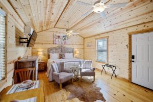 The bedroom at a rental cabin near museums in Fredericksburg, TX.