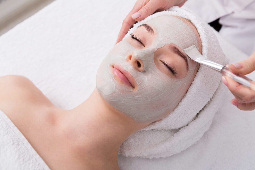 A photo of a woman getting a facial at one of the spas in Fredericksburg, TX.